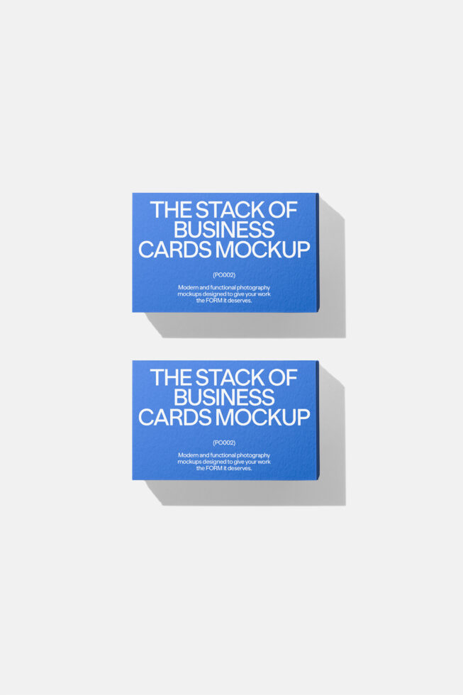Two stacked business card mockups with bright blue covers, subtle gray shadows underneath each stack