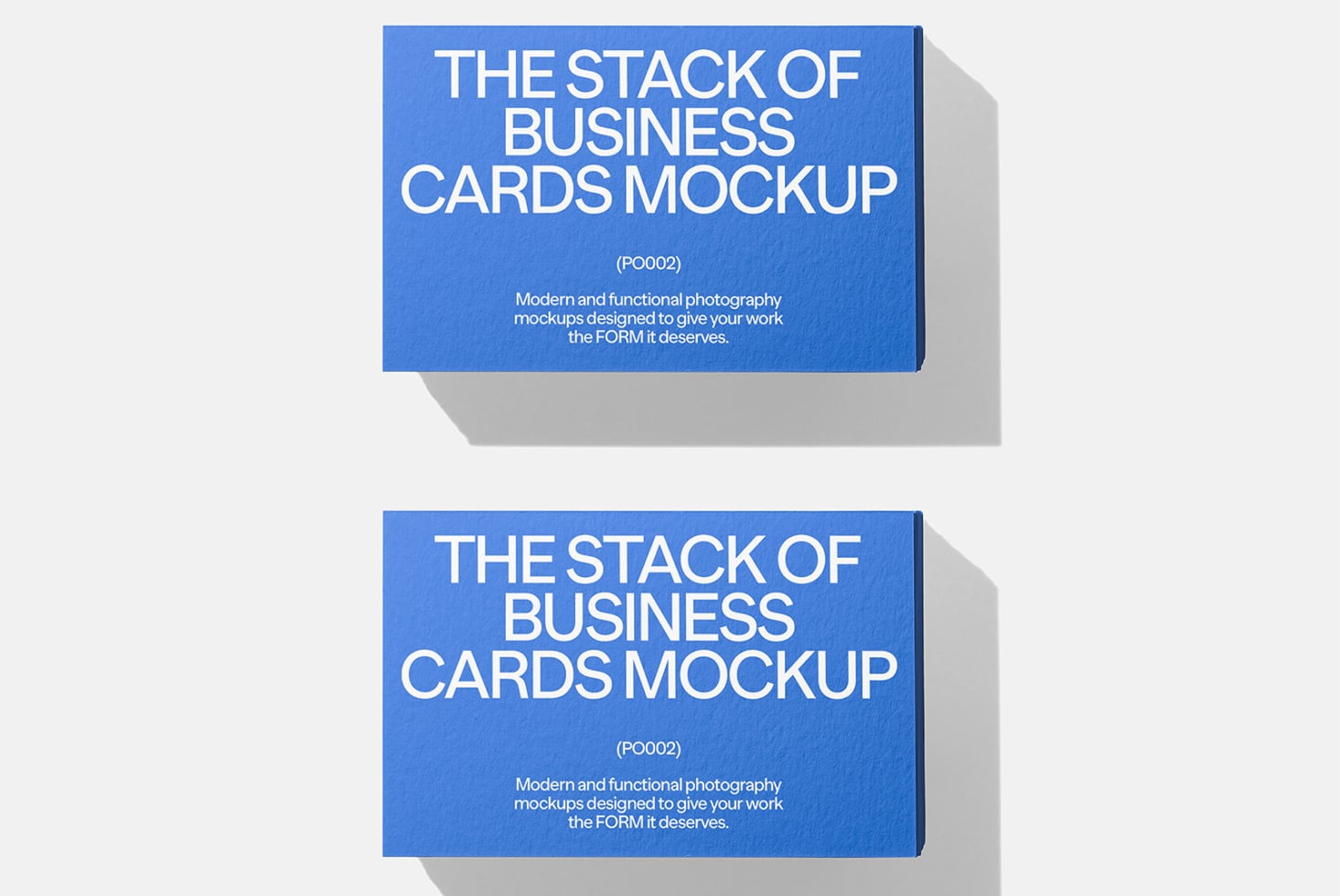 Stacked business cards mockup in bright blue with white typography