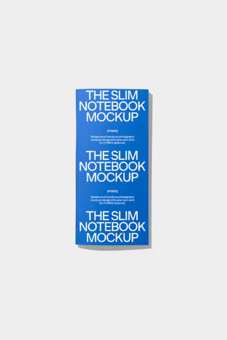 Stacked slim notebook mockup showing three blue covers fanned out with shadow depth effect