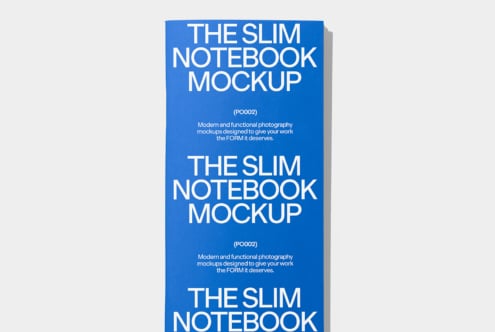 Stack of blue slim notebooks with visible depth, white text repeated across multiple visible covers