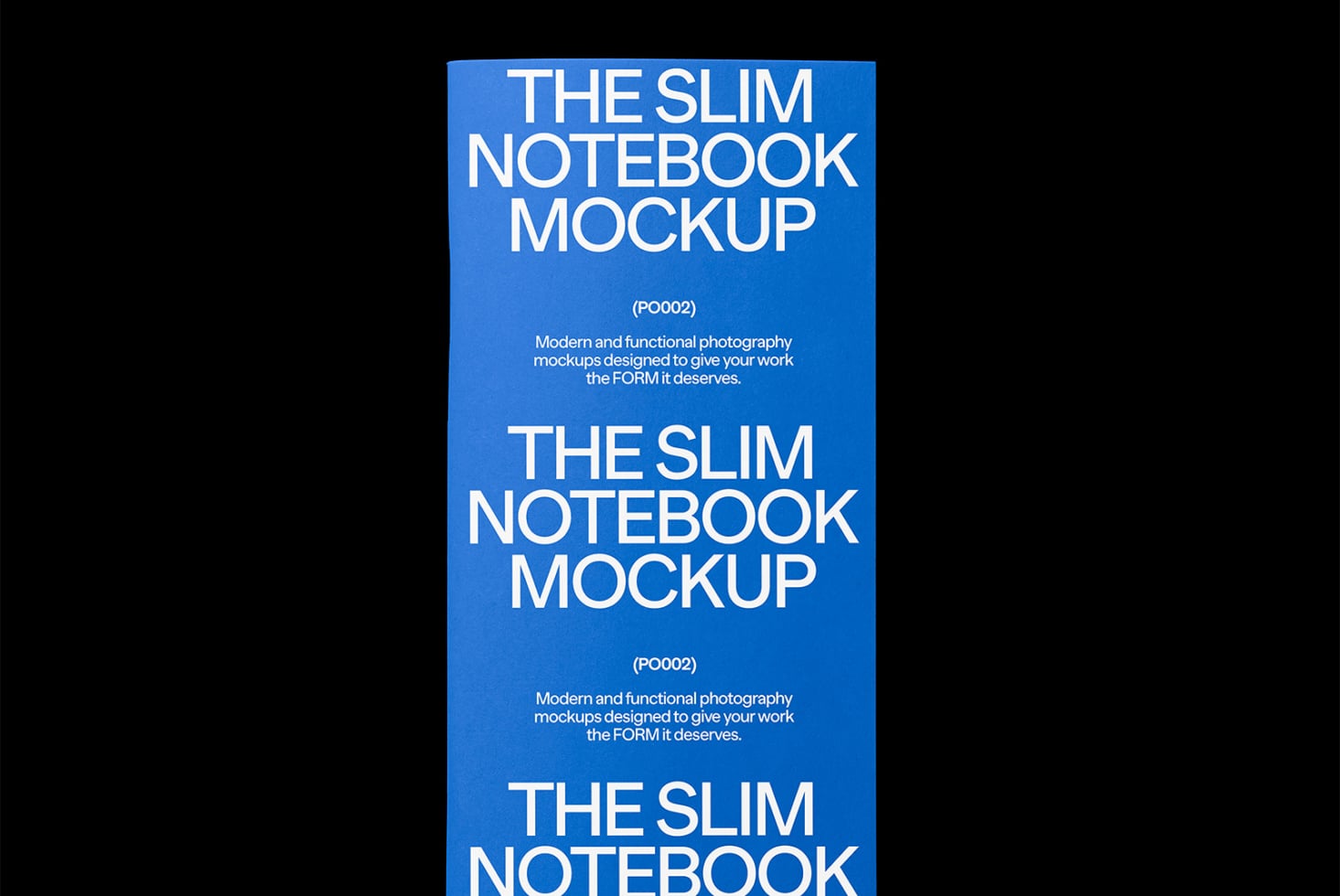 Vertical stack of three slim blue notebooks arranged to show multiple cover designs on black background