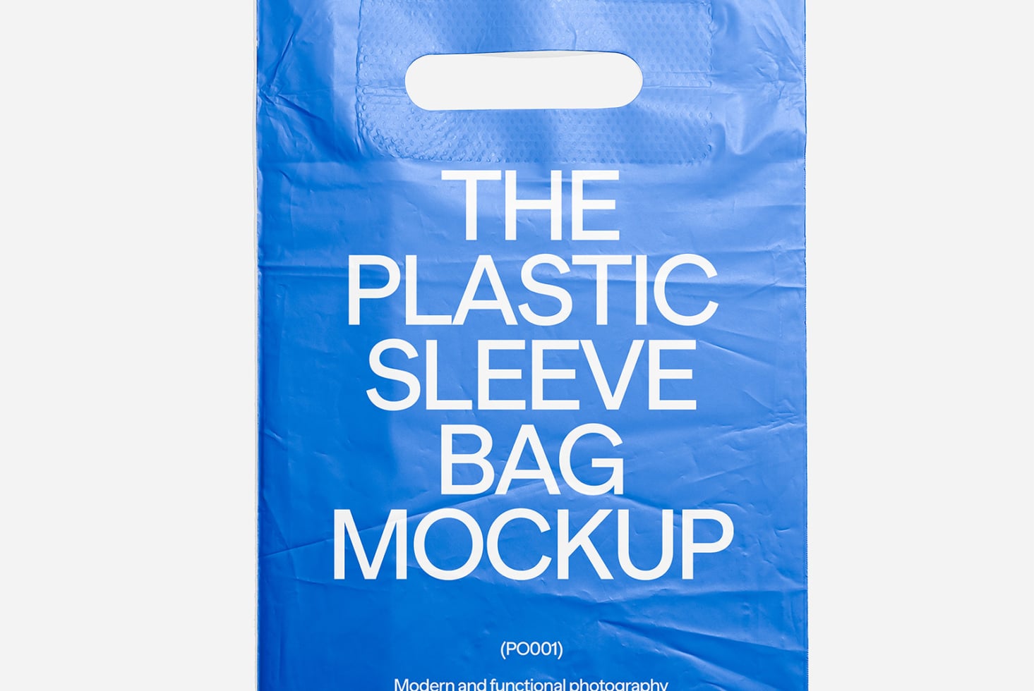Blue plastic carrying bag mockup with white rounded die-cut handles, bold white typography displayed