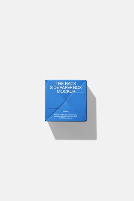 Blue paper box mockup shown from back with diagonal fold lines
