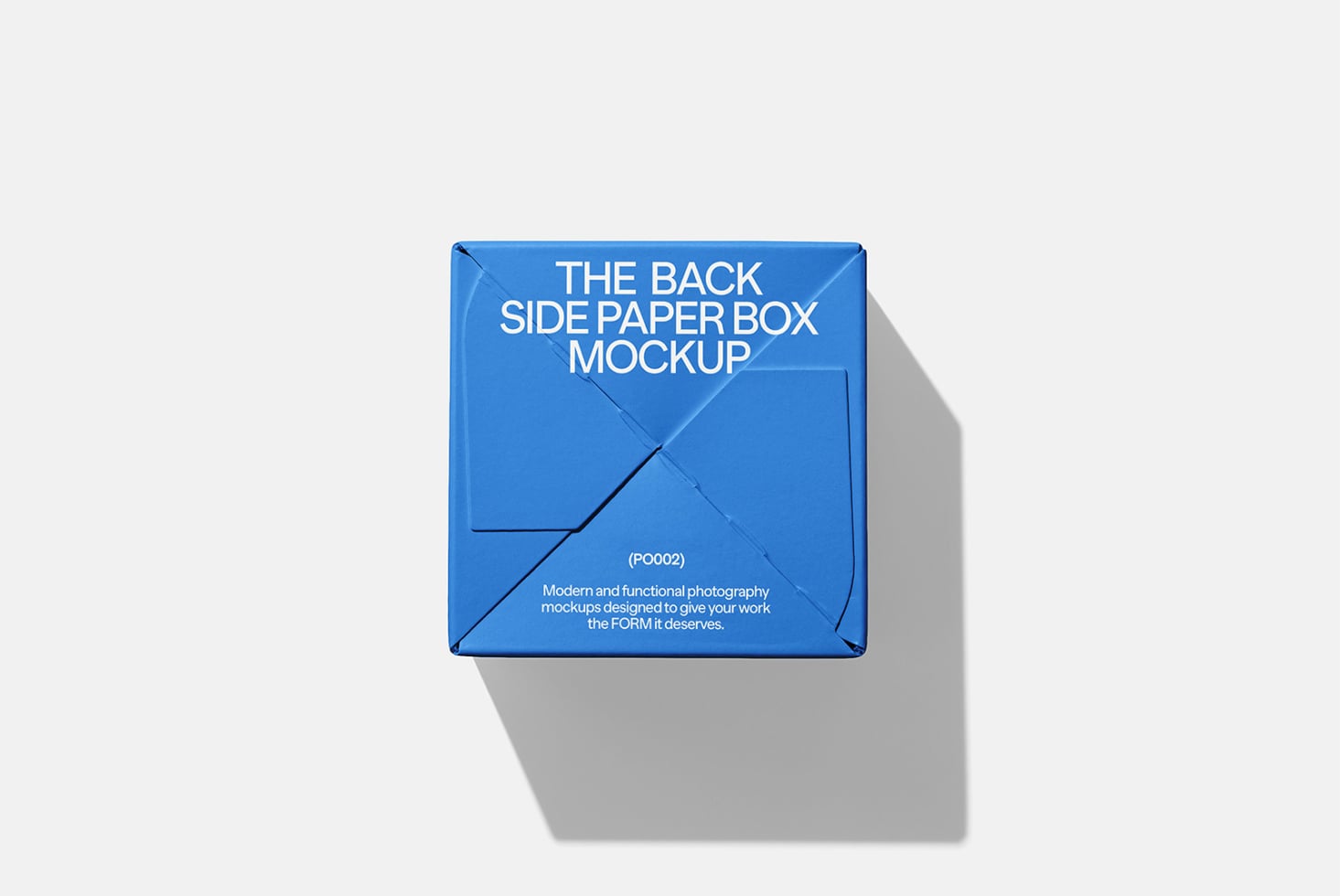 Blue paper box mockup with back panel view on light gray background