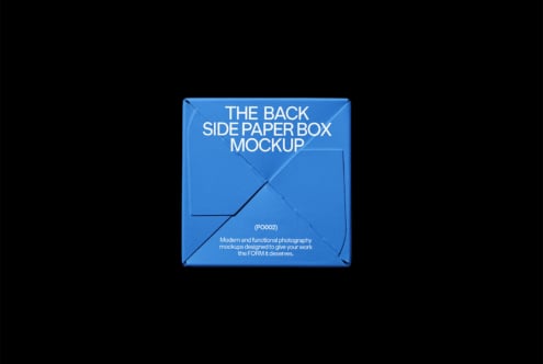 Blue cardboard box mockup on black background with diagonal creases