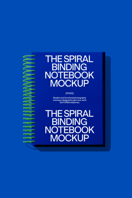Blue spiral-bound notebook mockup on vibrant background ideal for showcasing designs. Graphic designers notebook mockup digital asset bright colors.