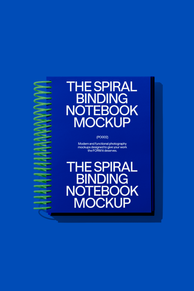 Blue spiral-bound notebook mockup on vibrant background ideal for showcasing designs. Graphic designers notebook mockup digital asset bright colors.