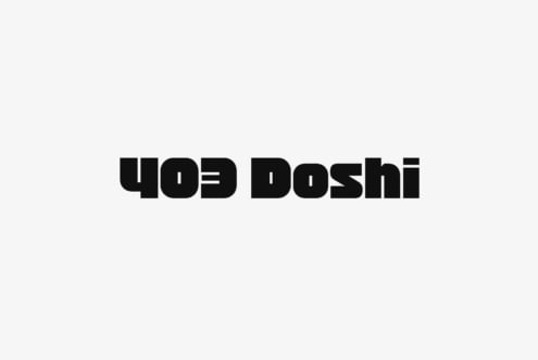 Doshi font sample showing condensed bold letterforms with reversed text effect