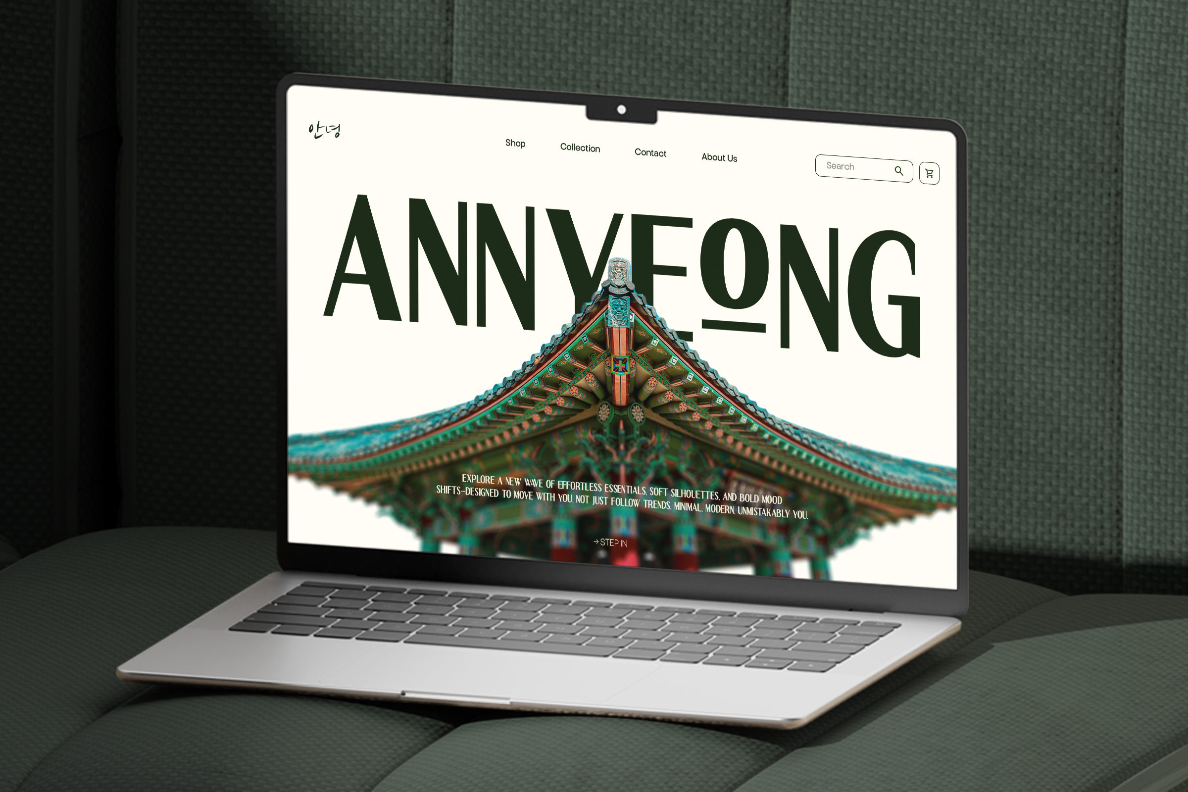 Laptop displaying ANNYEONG website with ornate Asian architecture imagery