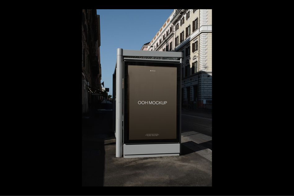 Bus stop advertising display mockup in urban setting with architectural details. Perfect for showcasing digital designs and out of home marketing assets.