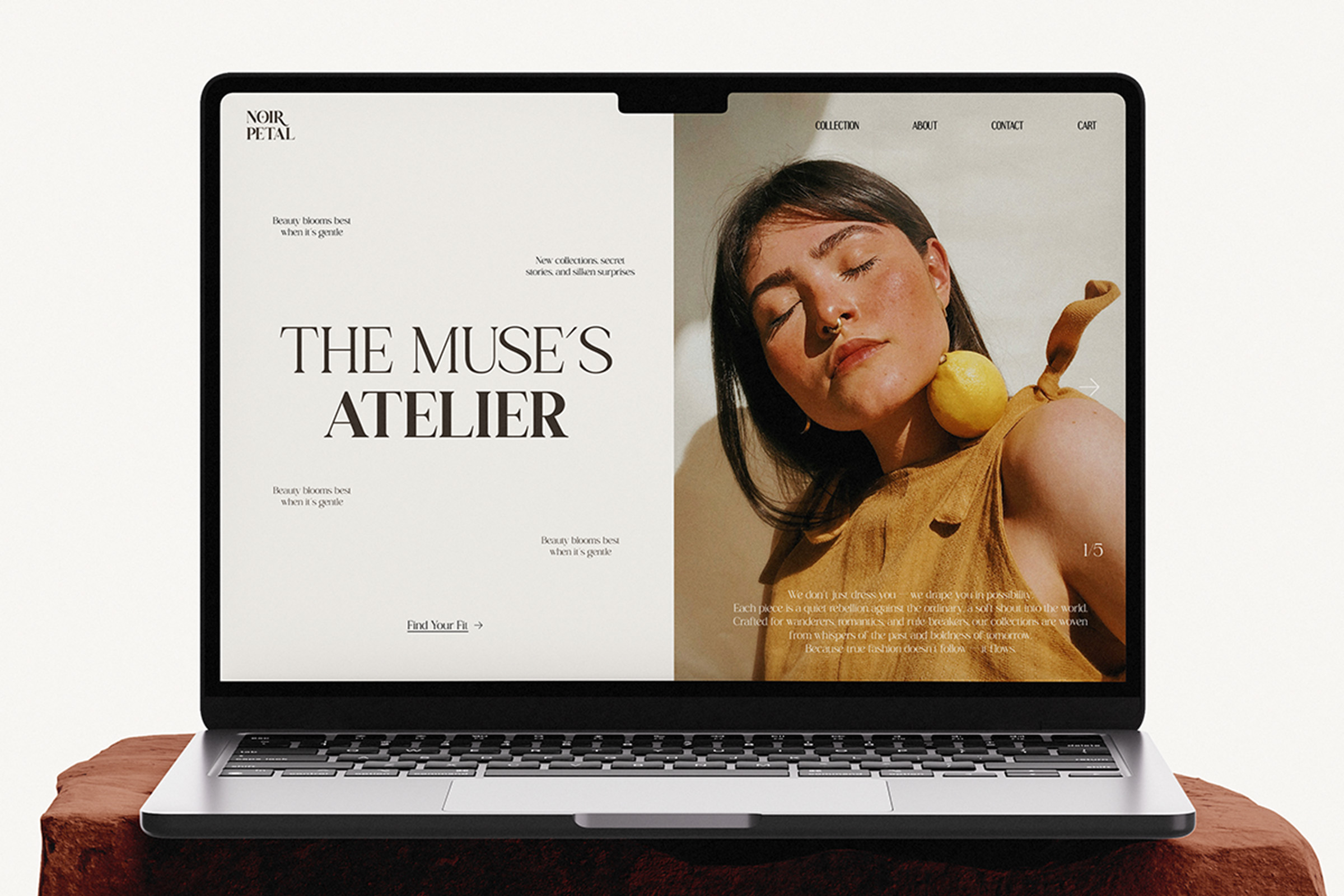 Laptop mockup displaying luxury fashion website with woman holding yellow fruit, navigation menu