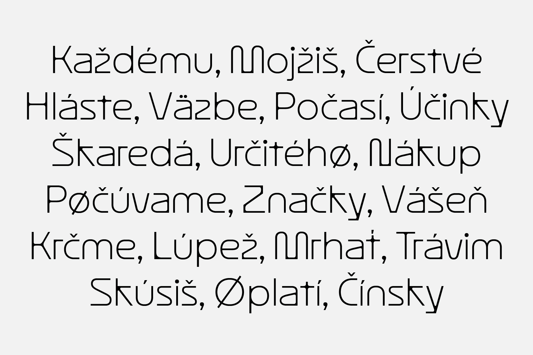 Serif font sample in light gray displaying text with various diacritical marks across multiple lines