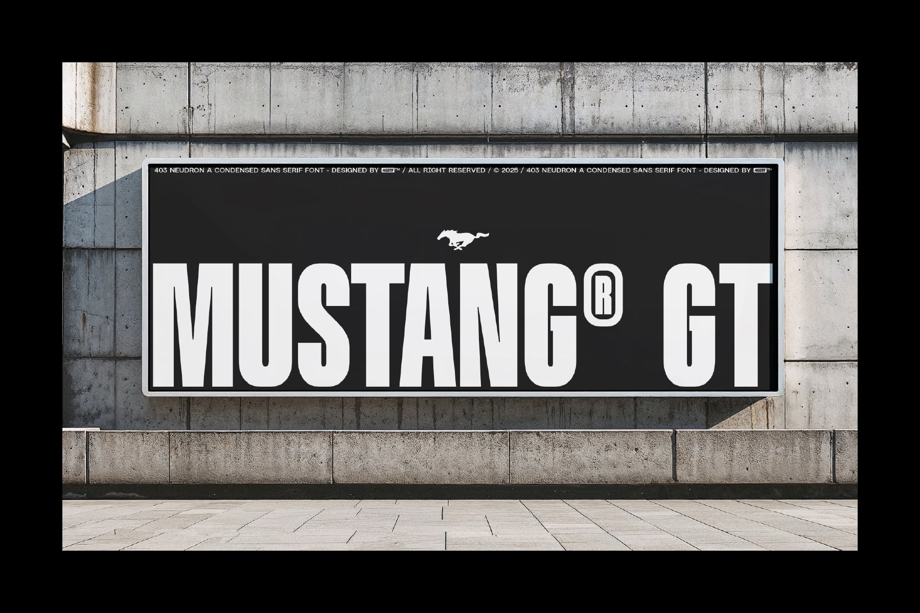 Mustang GT logo on black sign mounted on concrete wall