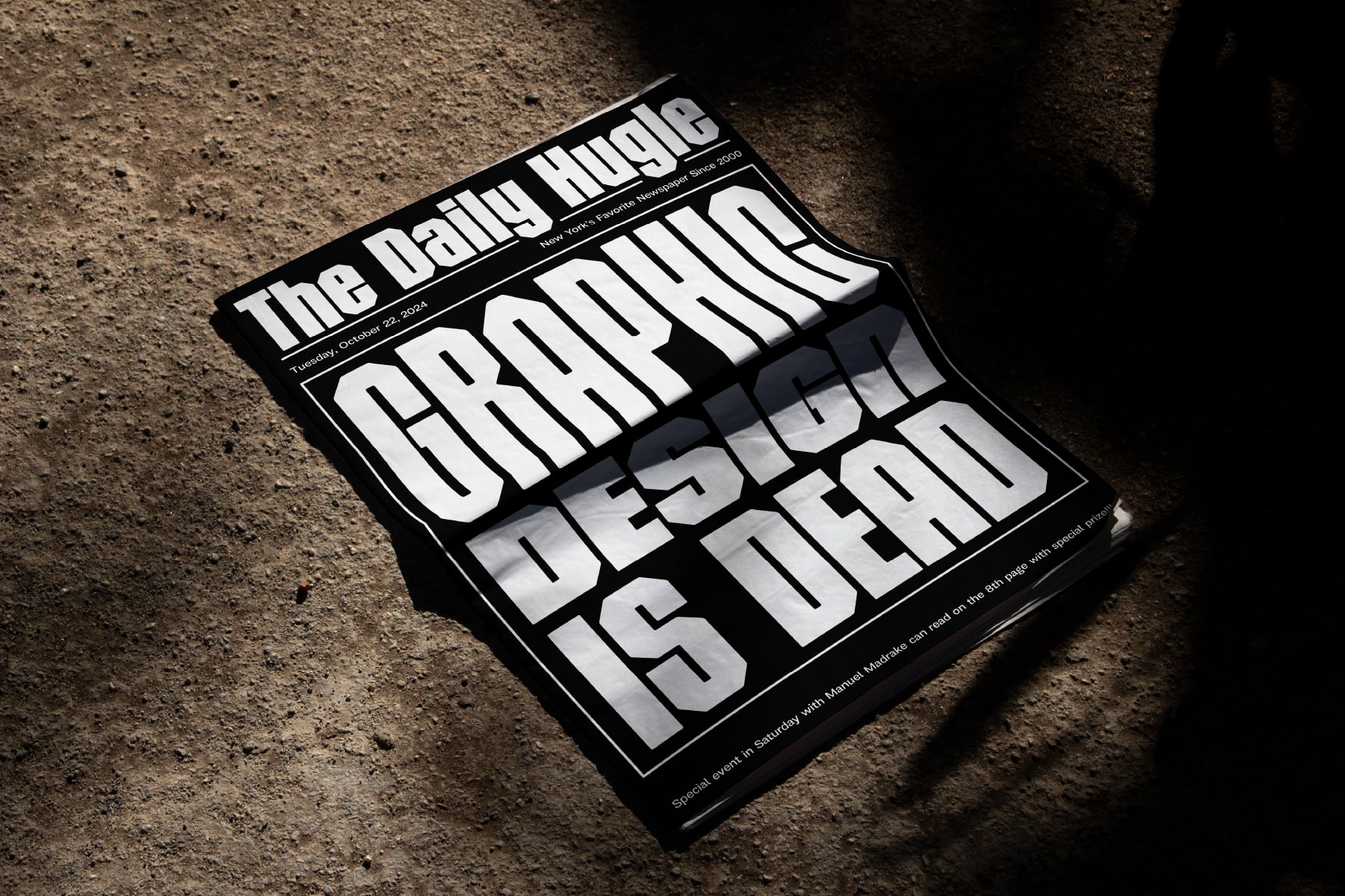 Daily Huddle newspaper mockup lying on concrete ground