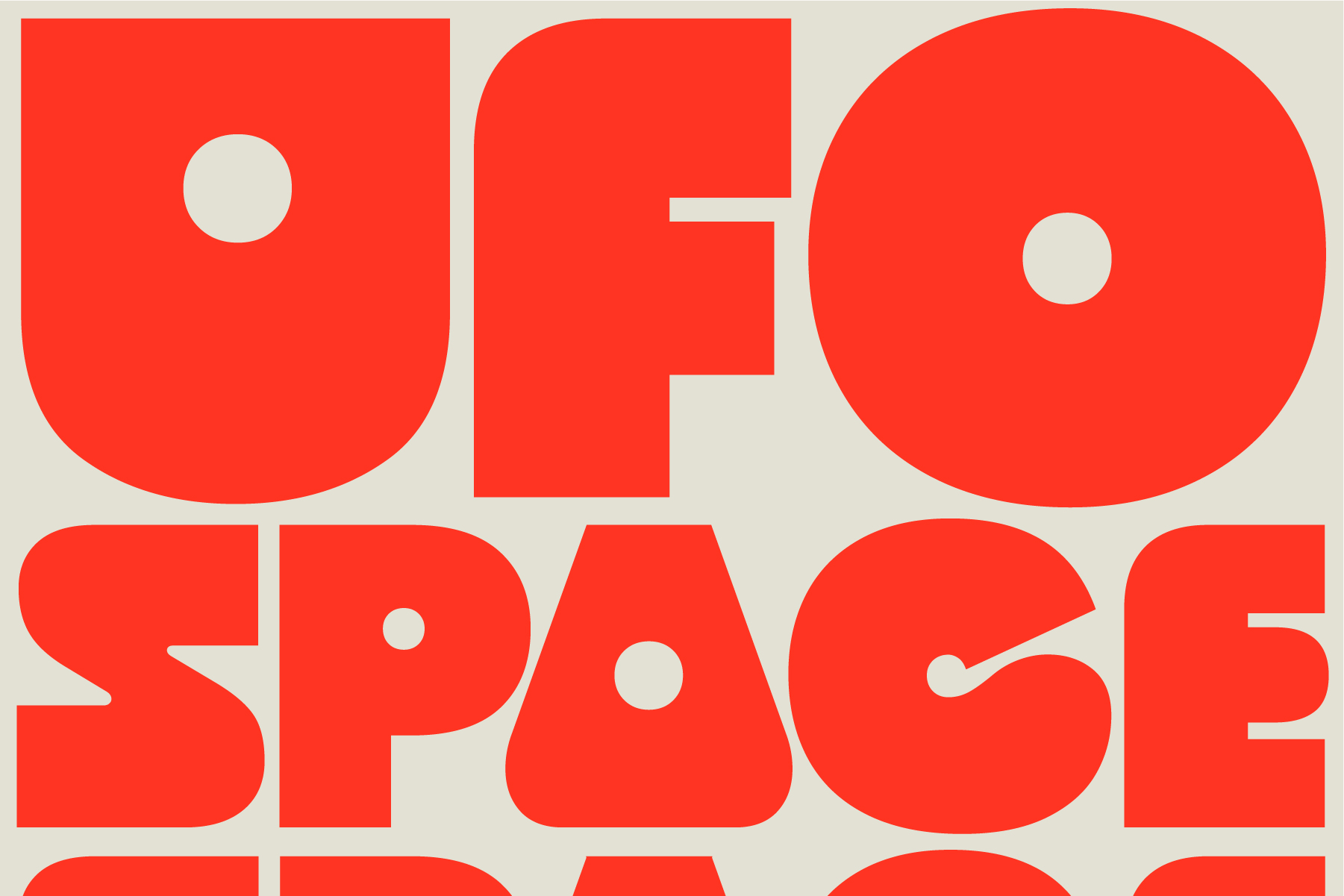 Oversized red letters spelling UFO against cream background with circular cutouts