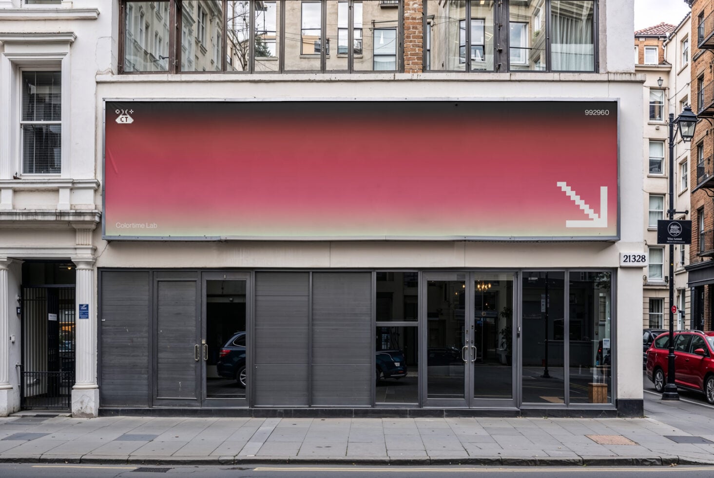 Street billboard mockup displaying red to yellow gradient background on building