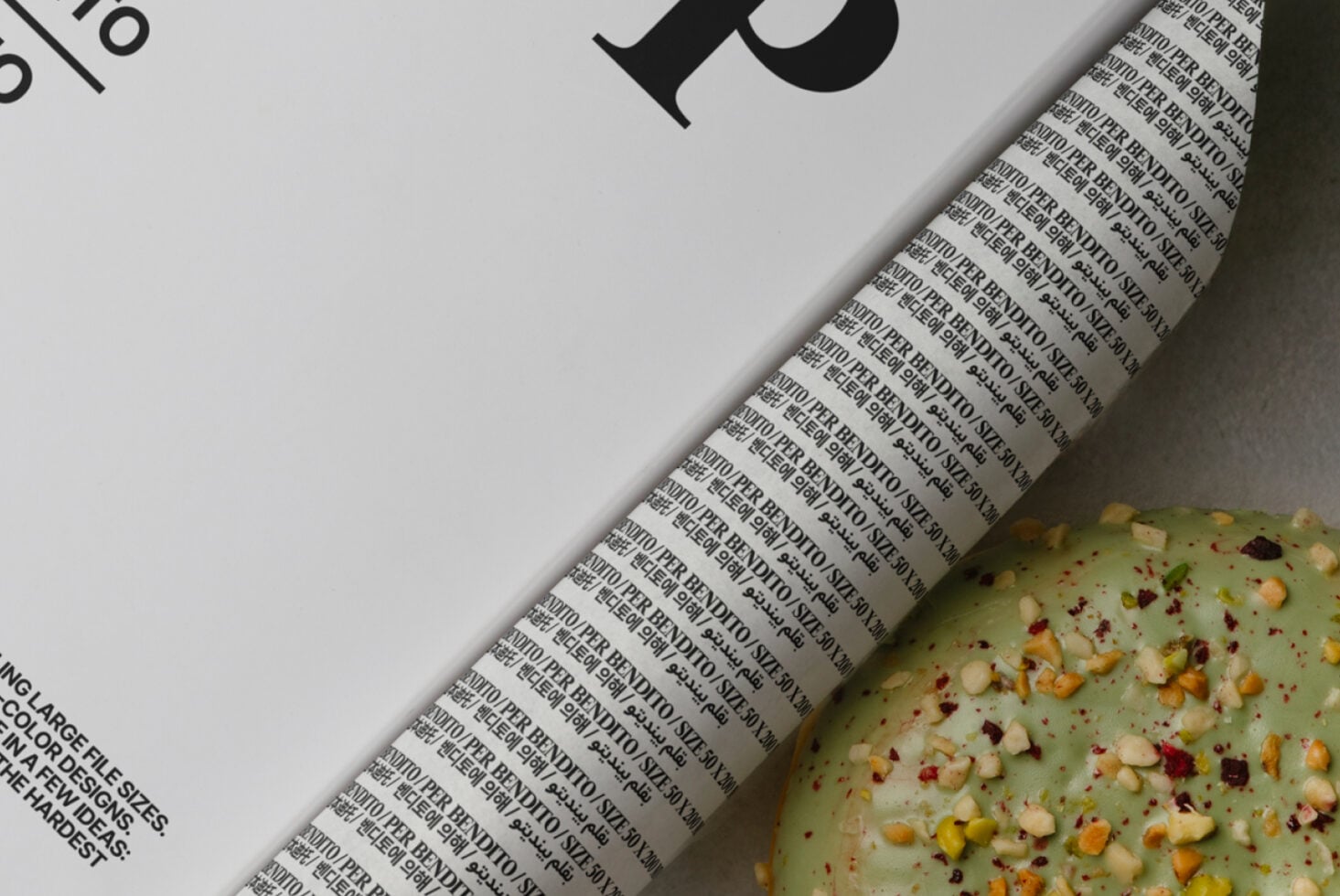 Light book cover detail with repeated text pattern near seeded crackers