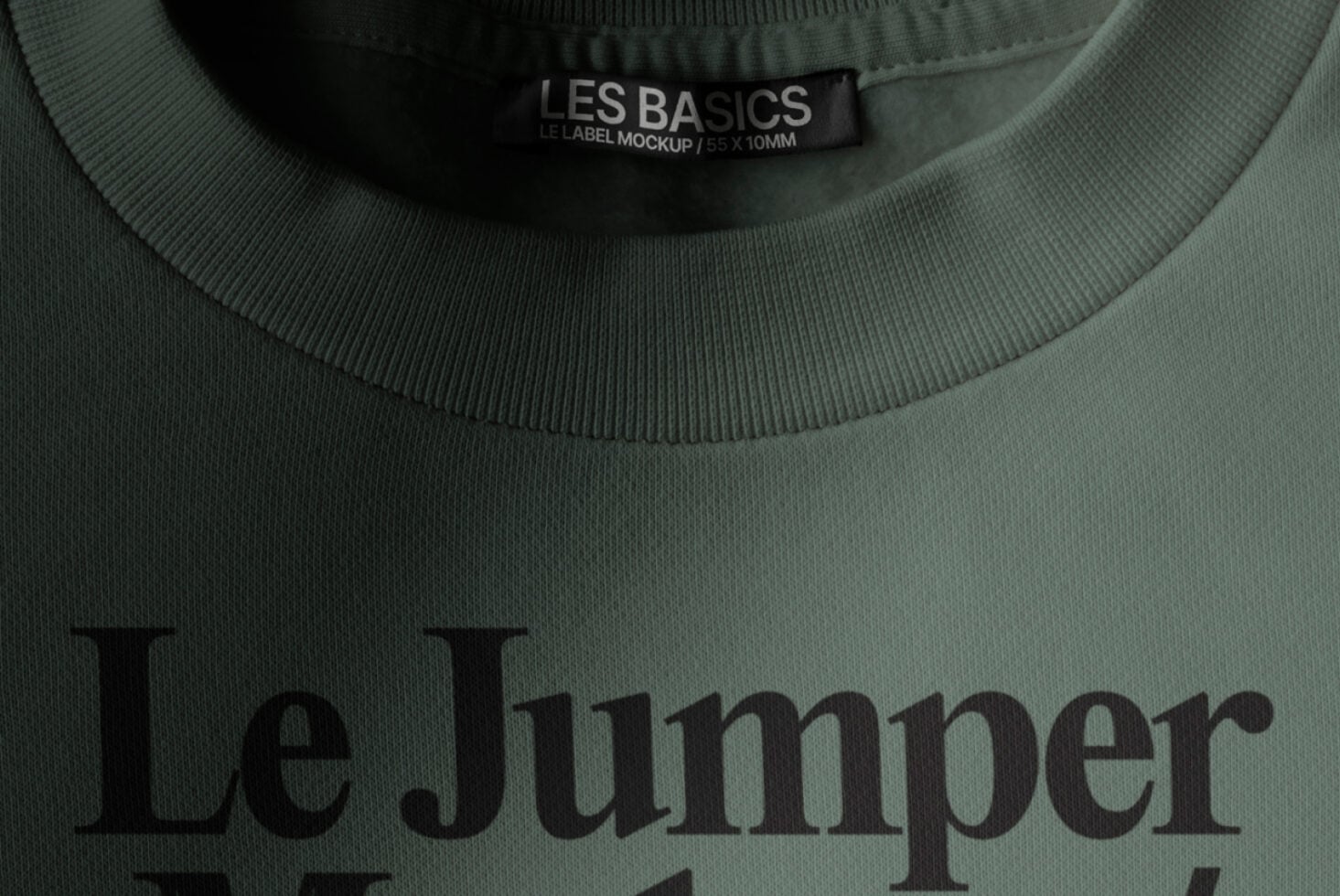Sage green sweatshirt with Les Basics woven neck label showing Le Jumper text