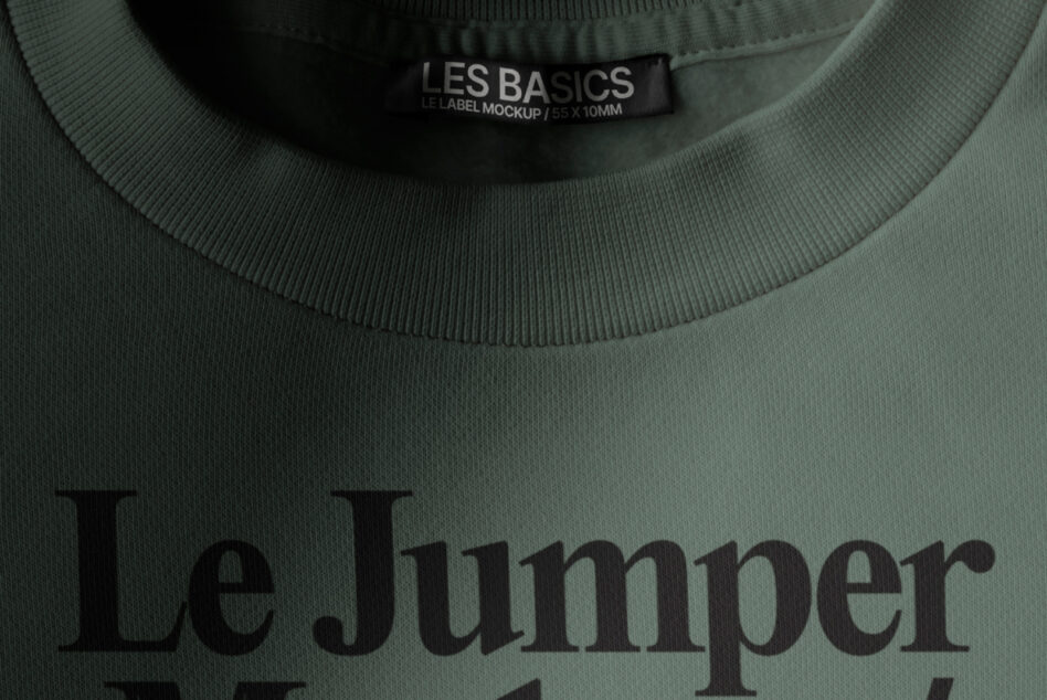 Sage green sweatshirt with Les Basics woven neck label showing Le Jumper text