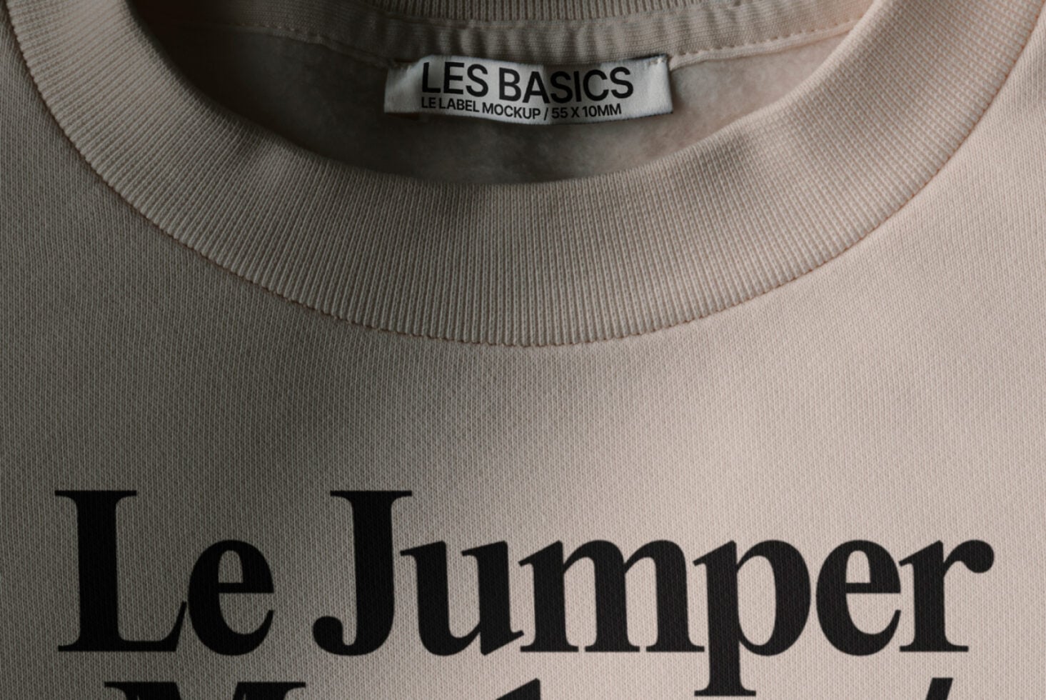 Pale pink sweatshirt with Les Basics woven neck label displaying Le Jumper branding