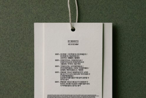Hang tag mockup on twine, white background with green accent panels