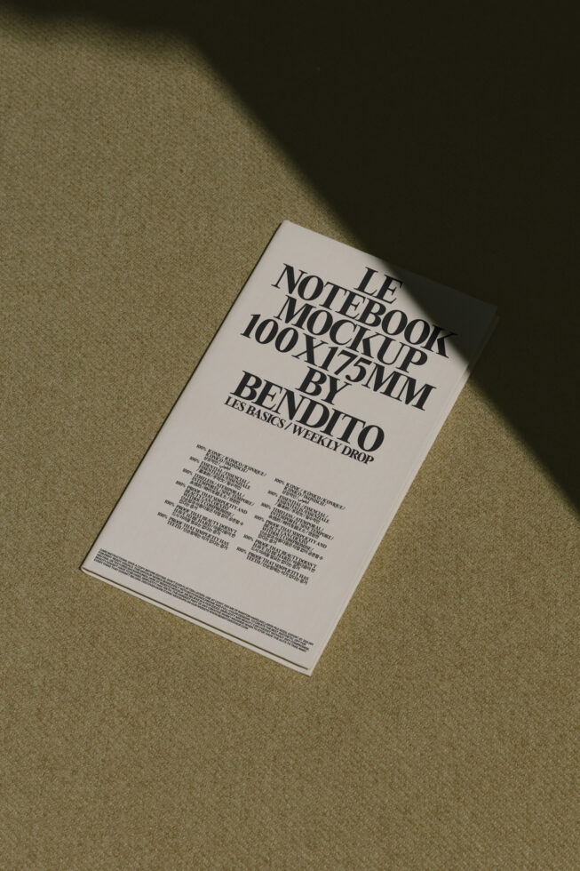 White notebook mockup on linen fabric with overhead sunlight