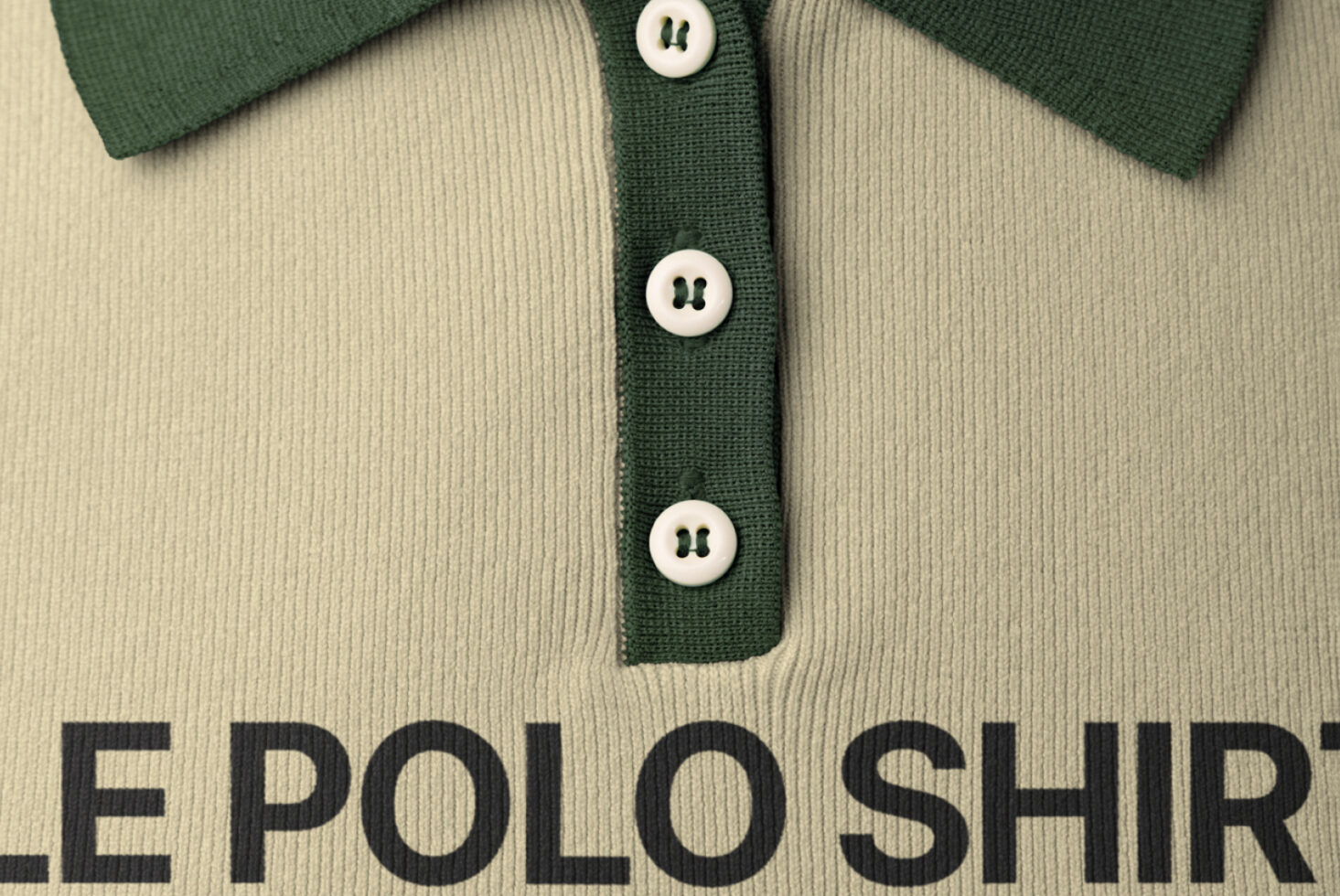 Cream polo shirt with green trim, white buttons down center placket