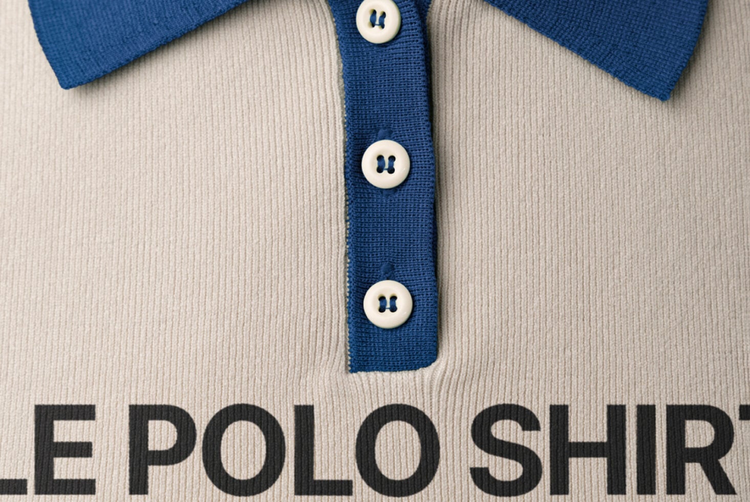Blue polo shirt with cream body, white buttons down front panel