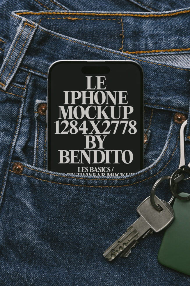 Dark phone mockup on denim pocket with silver keys beside it for product display
