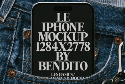 Dark phone mockup on textured denim fabric with brass buttons visible on sides