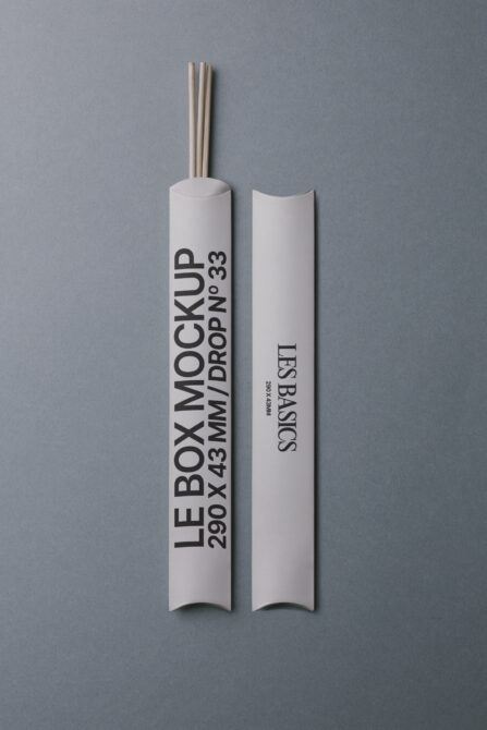 White cylindrical box with wooden sticks, branded Le Box Mockup, front view