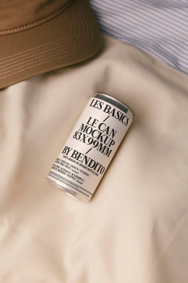 White can mockup with black label on beige fabric with striped shirt