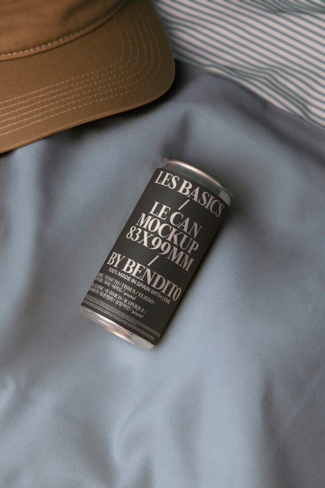 Dark can mockup with white label on gray fabric with tan cap