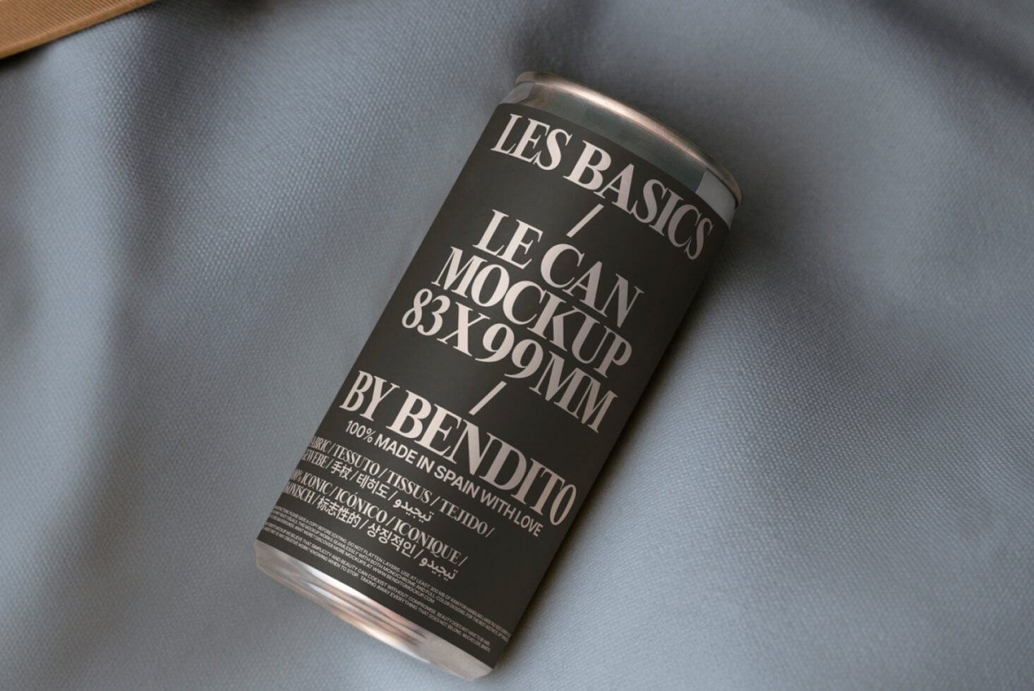 Dark can mockup with white label on light blue shirt fabric