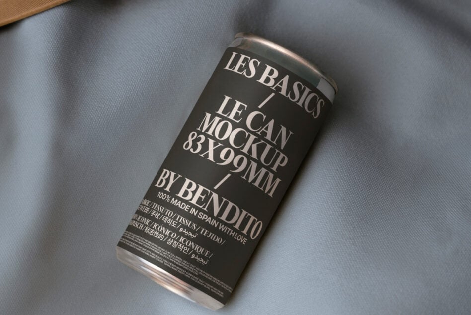Dark can mockup with white label on light blue shirt fabric