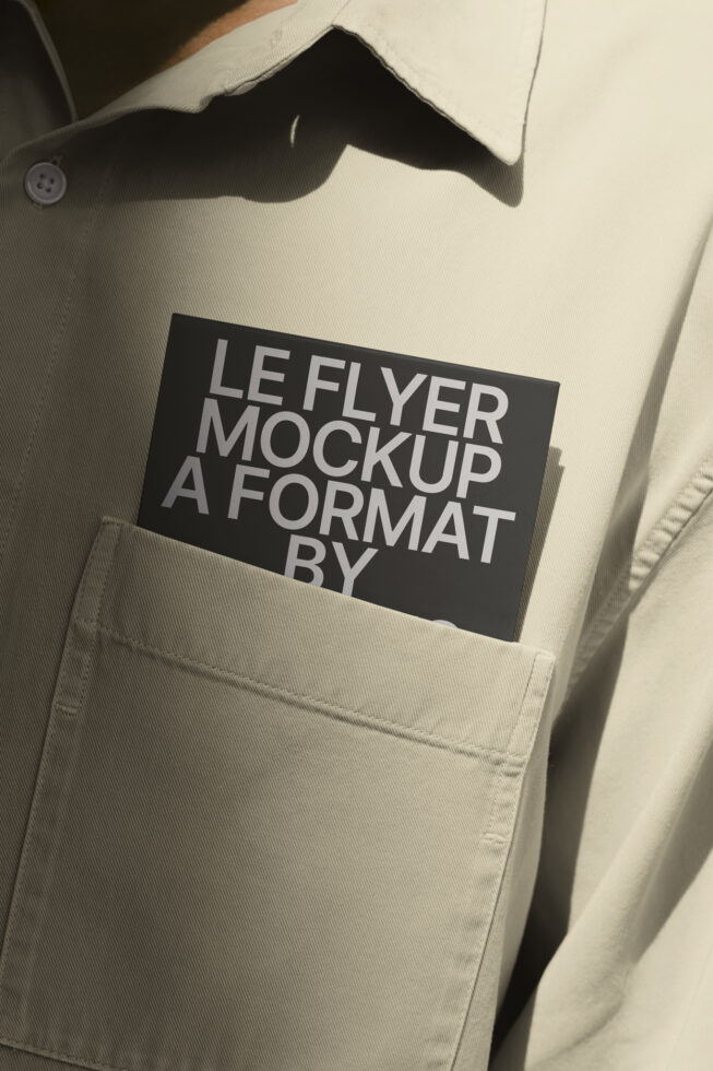 Black leaflet with gray text tucked in cream blazer pocket