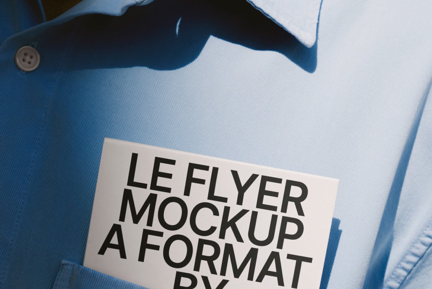 White leaflet mockup nested in blue striped shirt pocket