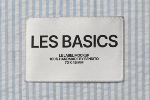 White woven label on blue striped fabric with Les Basics branding