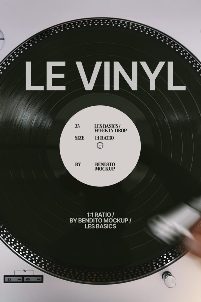 Black vinyl record with white center label showing Les Basics Weekly Drop information