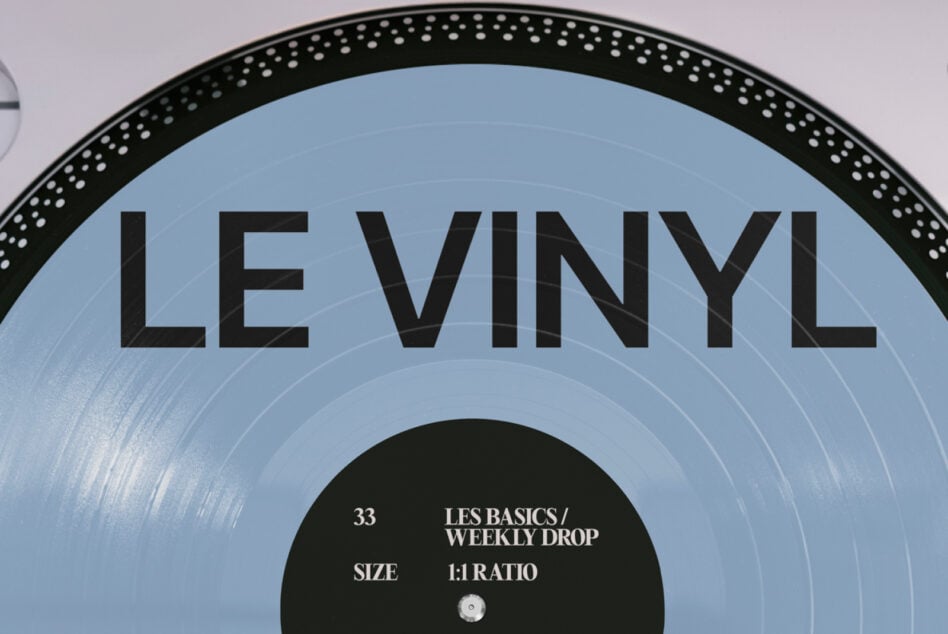 Light blue vinyl record with black rim displaying Les Basics Weekly Drop text overlay