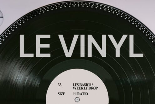 Black vinyl record with white center label featuring Les Basics Weekly Drop details