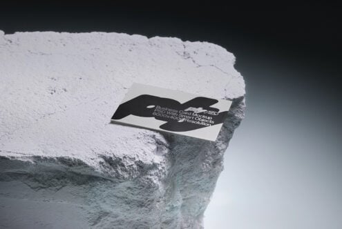 Business card mockup with black organic cutout on rocky ledge