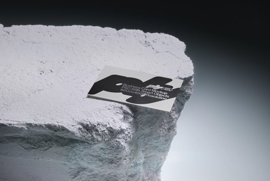 Business card mockup with black organic cutout on rocky ledge