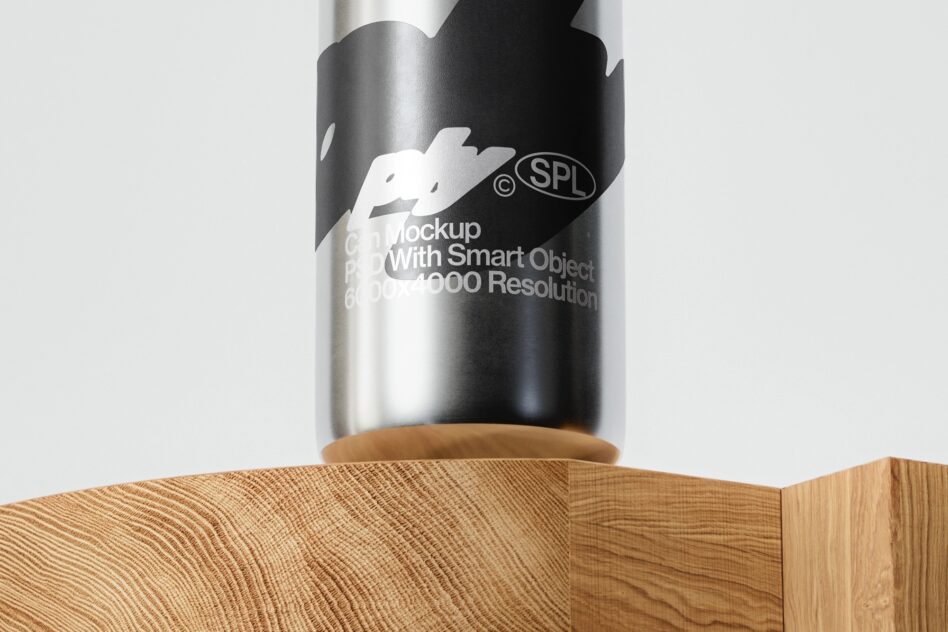 Close up of metallic can with black label design on wooden surface
