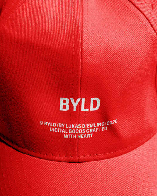 Red cap showing BYLD branding with copyright text on back