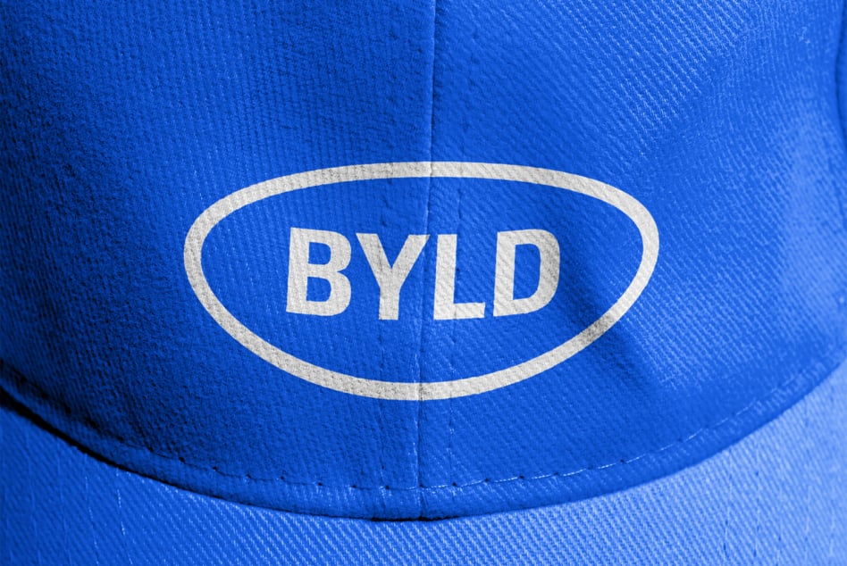 Close up of blue cap front with BYLD oval logo patch