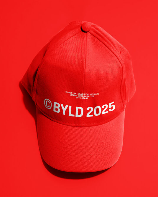 Red cap with white BYLD 2025 lettering on bright red background