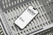 iPhone Pro on white slat wall surface, clean minimal mockup for app showcase