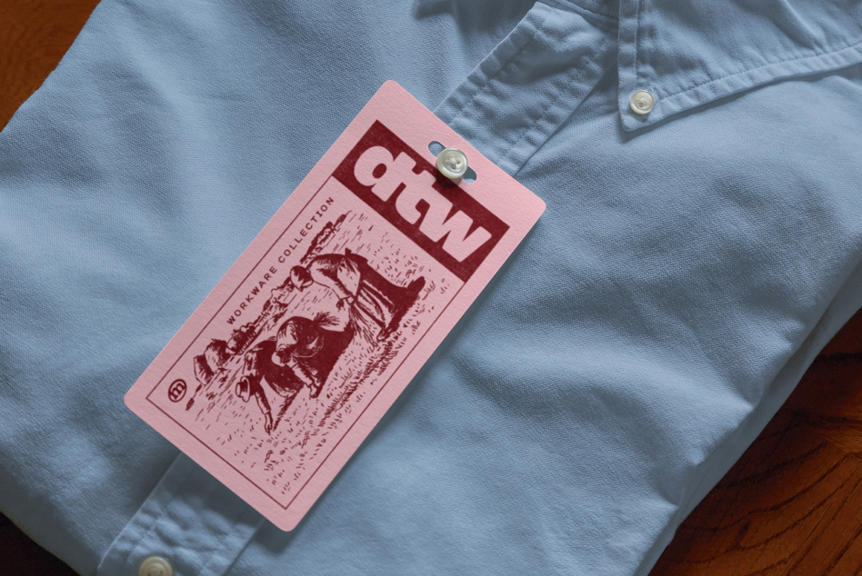 Light blue shirt with pink hang tag mockup showing workware collection
