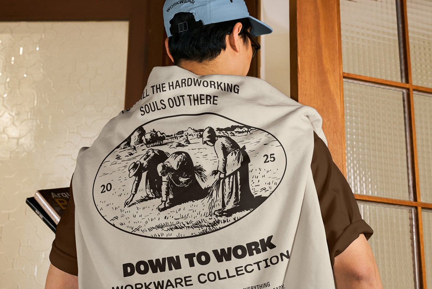 Off-white sleeveless vest with black engraved worker illustration